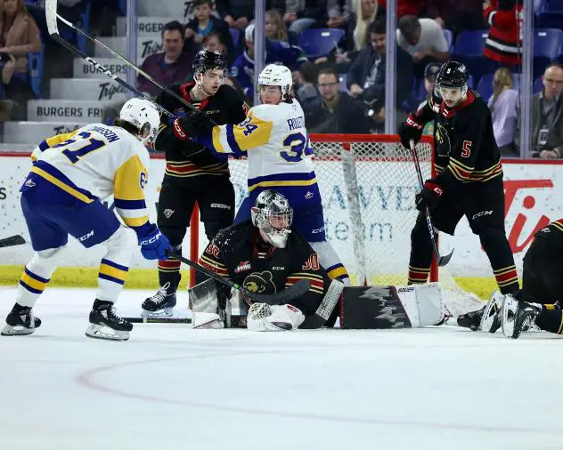 Saskatoon Blades' Conner Roulette battles the Vancouver Giants