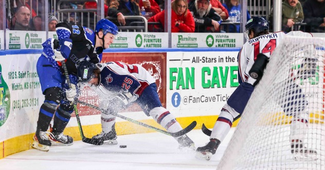 Wichita Thunder 's Peter Bates versus Tulsa Oilers' Andrew Jarvis