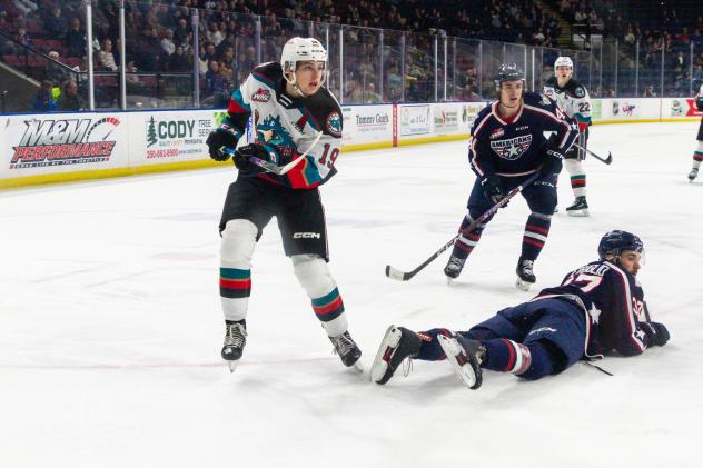 Kelowna Rockets left wing Adam Kydd (left) vs. the Tri-City Americans