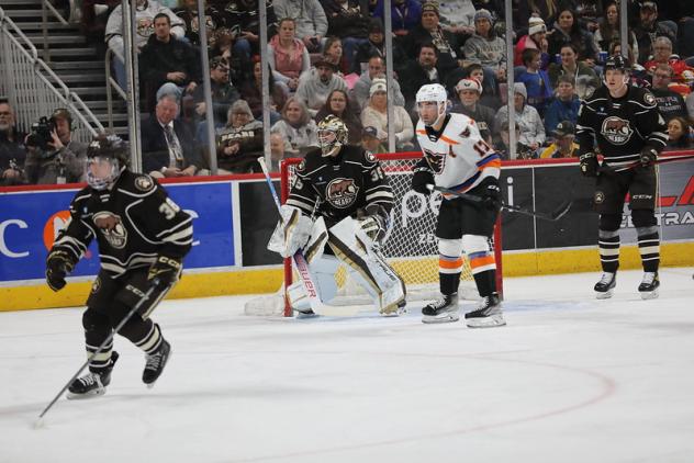 Hershey Bears' goalie Zachary Fucale and Lehigh Valley Phantoms' Garrett Wilson on the ice