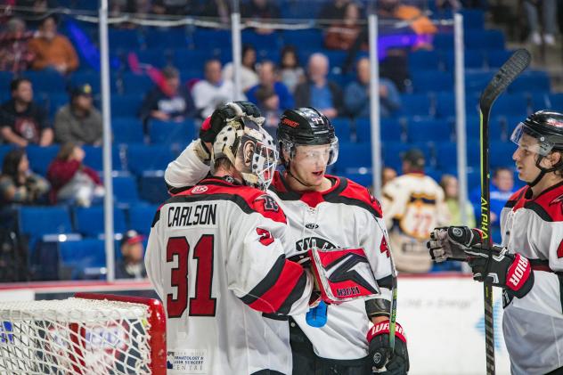 Rapid City Rush's Adam Carlson and Tyson Helgesen celebrate win