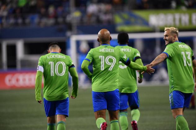 Seattle Sounders FC react after a goal in their MLS season opener