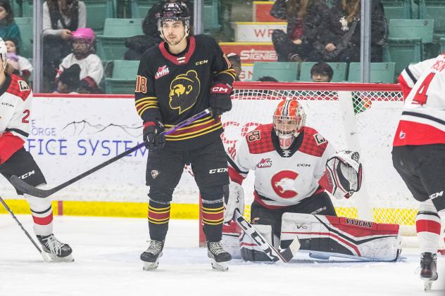 Vancouver Giants' Colton Langkow and rince George Cougars' Tyler Brennan