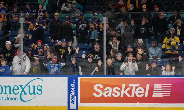 Saskatoon Blades fans cheer on the team