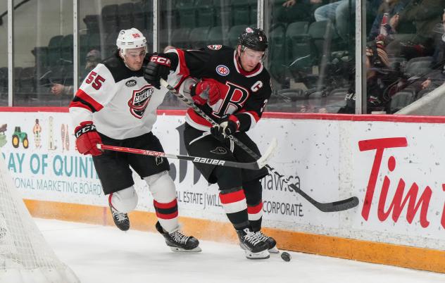 Utica Comets' Mason Geertsen battles Belleville Senators' Dillon Heatherington