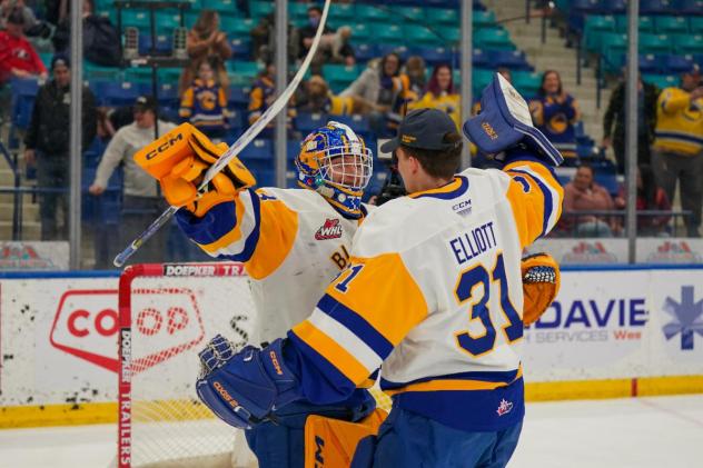 Saskatoon Blades' Austin Elliott and Ethan Chadwick celebrate win