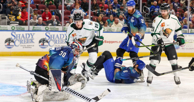 Wichita Thunder's Justin Kapelmaster, Zack Hoffman and Jay Dickman battle Utah Grizzlies' Cameron Wright and Tyler Penner