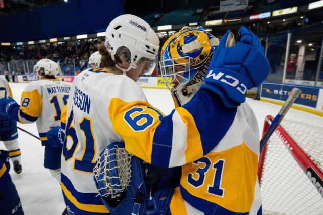 Saskatoon Blades' Jake Chiasson and Austin Elliott celebrate win
