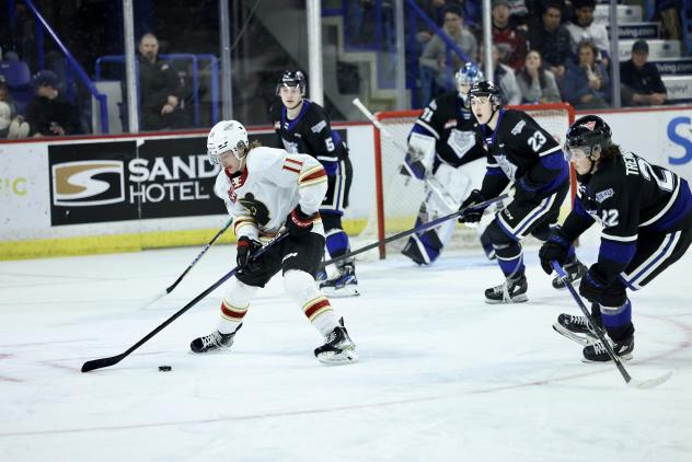 Vancouver Giants' Skyler Bruce in action against Victoria Royals' Austin Zemlak, Nate Misskey and Teydon Trembecky