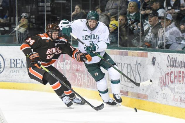 Defenseman Will Zmolek with Bemidji State (right)