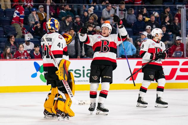Belleville Senators' Luke Richardson and Jake Lucchini celebrating victory with team
