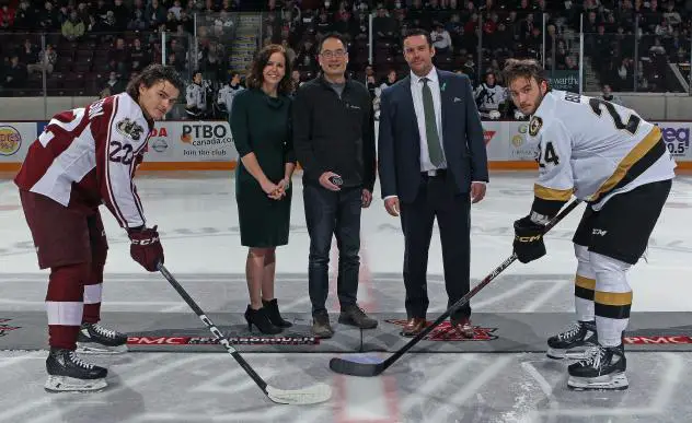 Peterborough Petes' Tucker Robertson and Kingston Frontenacs' Thomas Budnick with Allison Verner, Dr. Vincent Cheun and Petes' Associate Coach Andrew Verner