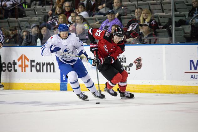Wichita Thunder's Mark Liwiski and Rapid City Rush's Carter Robertson in action