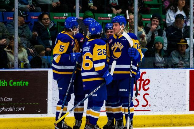 Saskatoon Blades' Aidan De La Gorgendiere, Spencer Shugrue and Josh Pillar