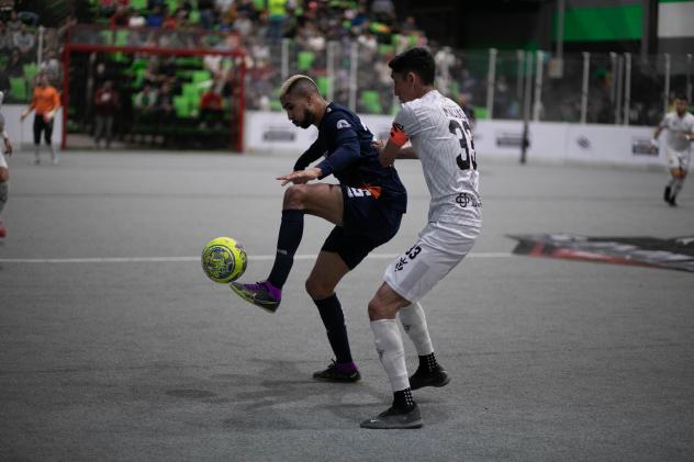 Tacoma Stars' Mike Ramos and Chihuahua Savage's Bryan Macias in action