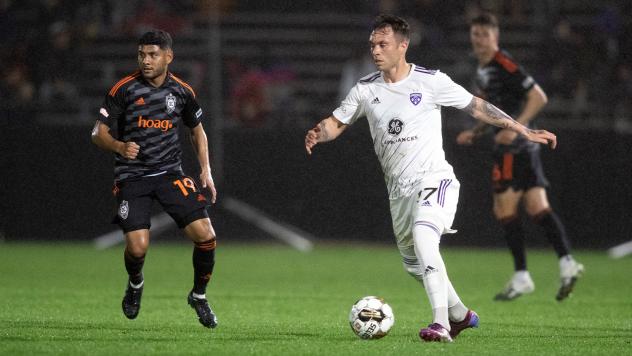 Orange County SC's Kevin Partida and Louisville City FC's Cameron Lancaster on game night