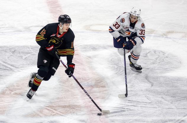 Vancouver Giants' Connor Dale and Kamloops Blazers' Shea Van Olm on the ice