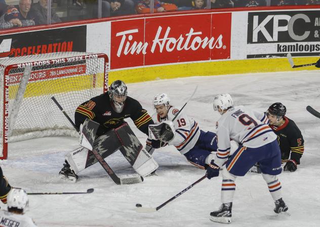 Vancouver Giants' Jesper Vikman battles Kamloops Blazers' Caedan Bankier