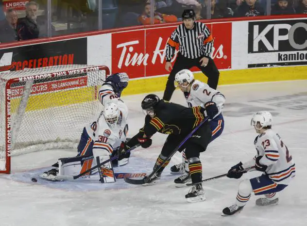 Kamloops Blazers' Michael Schnattinger, Logan Bairos and Dylan Sydor versus the Vancouver Giants