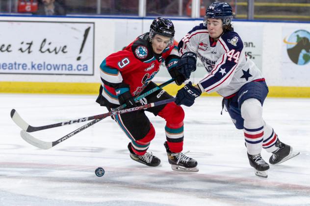 Kelowna Rockets' Marcus Pacheco battles Tri-City Americans' Chase Friedt-Mohr