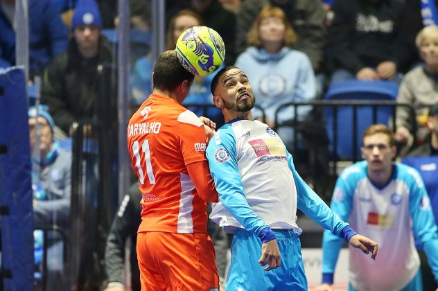 Ricardo Carvalho of the Florida Tropics (left) elevates for a header