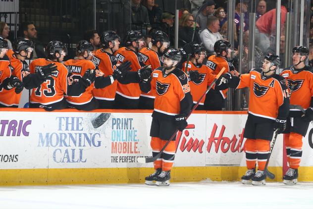 Lehigh Valley Phantoms forward Cooper Marody gives high fives along the bench