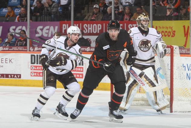 Lehigh Valley Phantoms' Garrett Wilson battles Hershey Bears' Bobby Nardella and Clay Stevenson