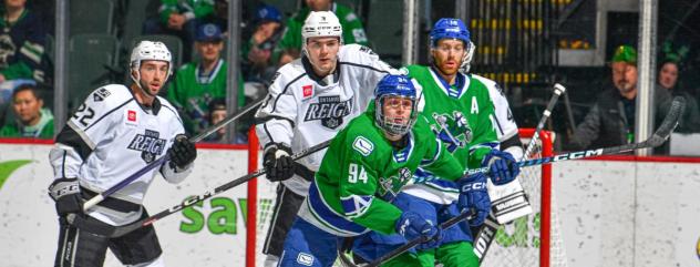 Ontario Reign's Alan Quine and Abbotsford Canucks' Linus Karlsson in action