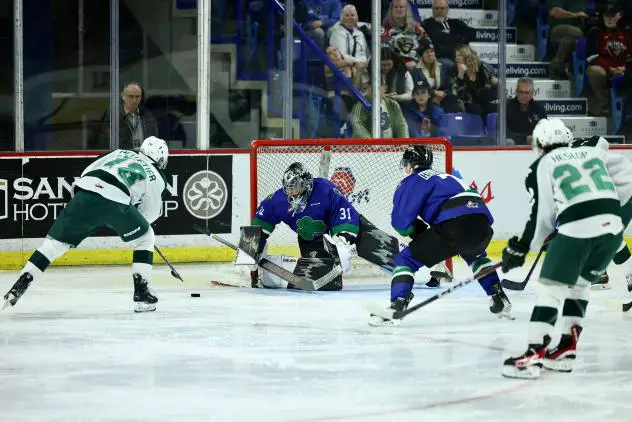 Vancouver Giants' Jesper Vikman versus Everett Silvertips' Raphael Pelletier