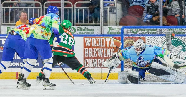 Wichita Thunder's Connor Walters, Dillon Boucher and Roman Basran battle Kansas City Mavericks' Mathieu Foget