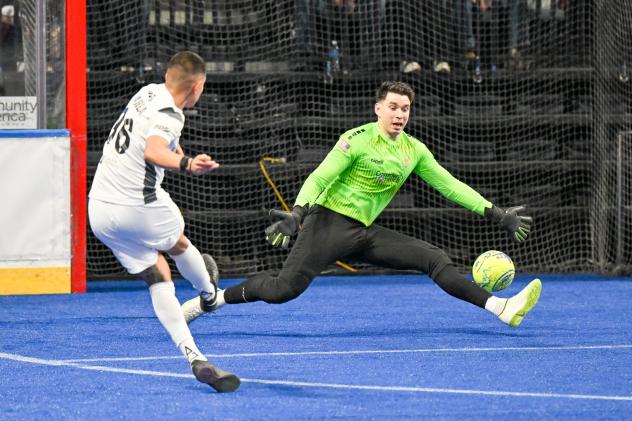 Florida Tropics forward Julio Varela takes a shot on Kansas City goaltender Nicolau Neto