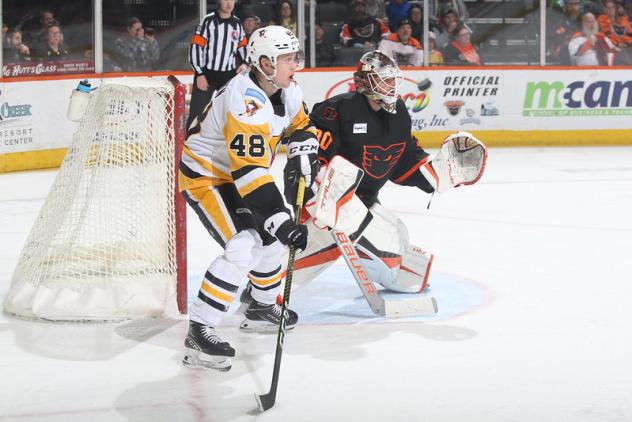 Wilkes-Barre/Scranton Penguins' Valtteri Puustinen battles Lehigh Valley Phantoms' Samuel Ersson