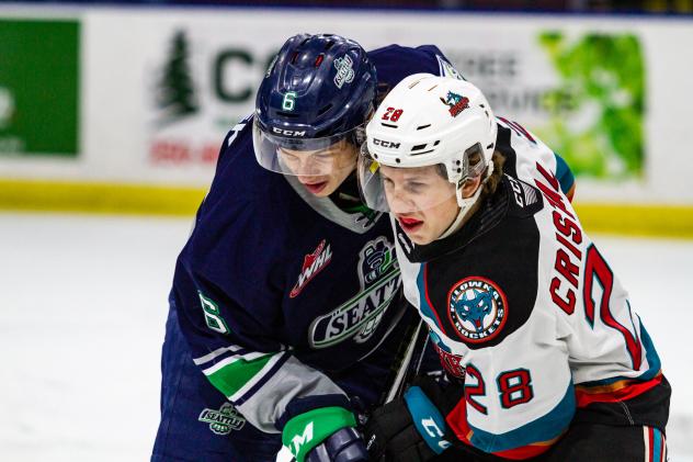 Seattle Thunderbirds' Luke Prokop battles Kelowna Rockets' Andrew Cristall