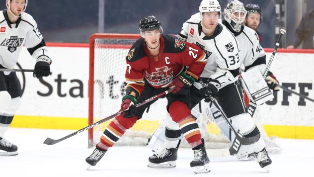 Tucson Roadrunners' Jan Jenik and Ontario Reign's Tobias Bjornfot and Cal Petersen in action