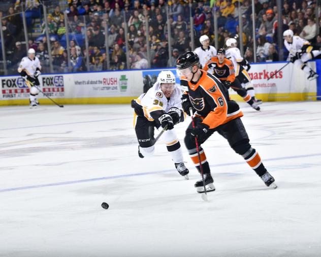 Wilkes-Barre/Scranton Penguins' Taylor Gauthier battles Lehigh Valley Phantoms' Emil Andrae