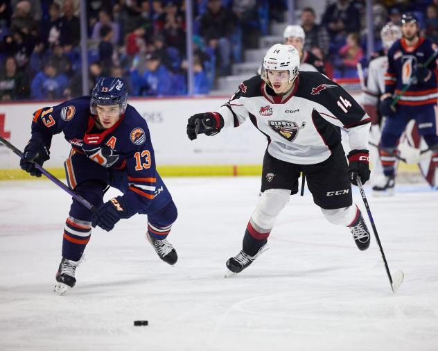 Vancouver Giants centre Ethan Semeniuk (right) against the Kamloops Blazers