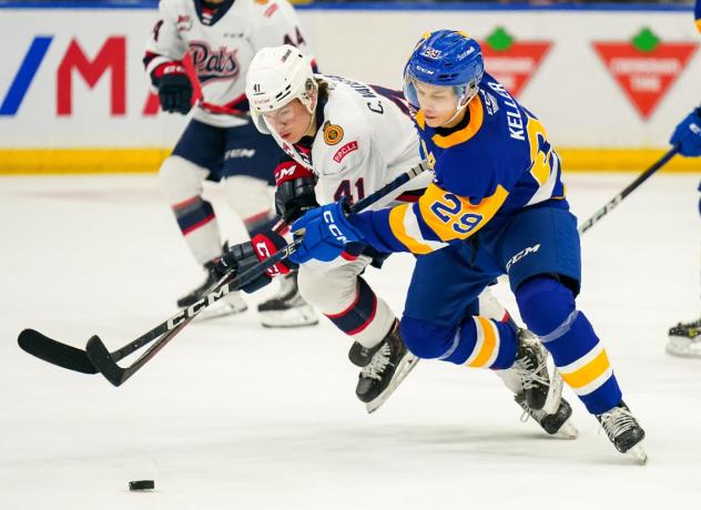 Saskatoon Blades left wing Jordan Keller (right) against the Regina Pats