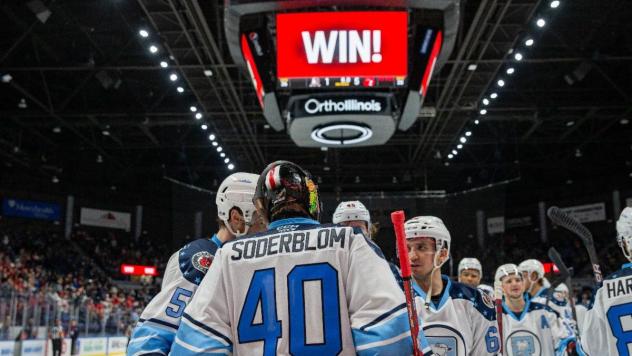 Rockford IceHogs and goaltender Arvid Soderblom celebrate a win