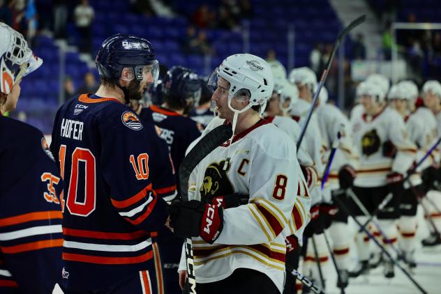 Vancouver Giants' Ty Thorpe congratulates Kamloops Blazers' Ryan Hofer