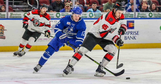 Wichita Thunder's Peter Bates and Rapid City Rush's Colton Leiter in action