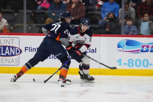 Flint Firebirds ' Matthew Jenken versus Saginaw Spirit's Sebastien Gervais