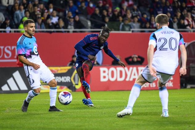 Chicago Fire FC's Kei Kamara versus Minnesota United FC's Franco Fragapaneo and Wil Trapp