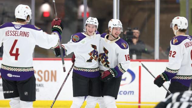 Tucson Roadrunners' Michael Kesselring, Lukas Klok, Ryan McGregor and Vladislav Kolyachonok celebrate win