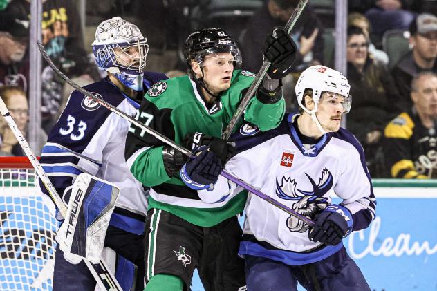 Texas Stars' Riley Tufte versus Manitoba Moose's Evan Cormier and Dean Stewart
