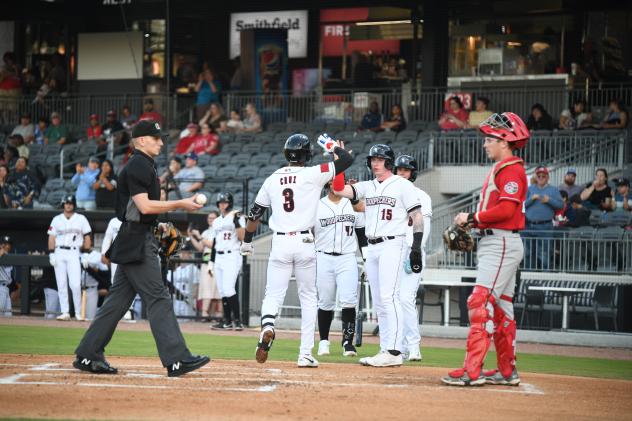 Fayetteville Woodpeckers' Narbe Cruz and Ryan Clifford celebrate win
