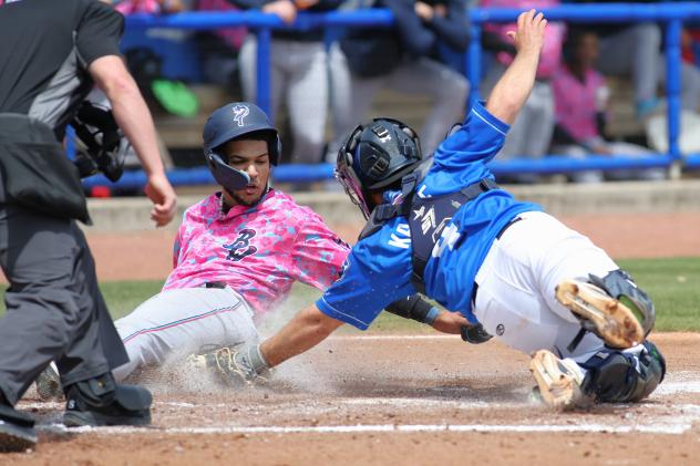 Biloxi Shuckers catcher Nick Kahle (right) applies the tag