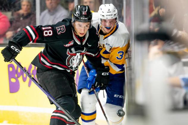 Red Deer Rebels' Jace Isley versus Saskatoon Blades' Blake Gustafson