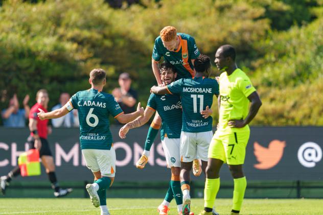 San Diego Loyal SC's Charlie Adams, Elliot Collier, Camden Riley and Tumi Moshobane celebrate win