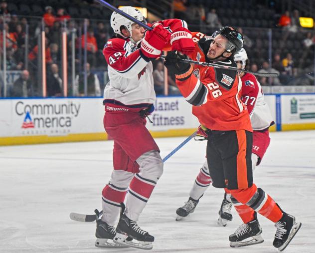 Zach Massicotte of the Allen Americans (left) fights with the Kansas City Mavericks