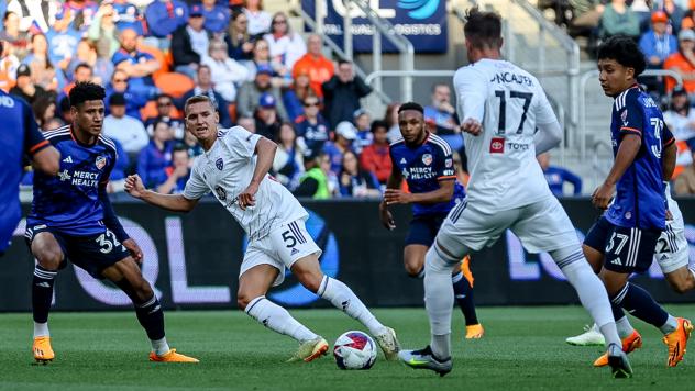 Louisville City FC's Rasmus Thellufsen and Cameron Lancaster battles FC Cincinnati's Ian Murphy and Stiven Jimenez